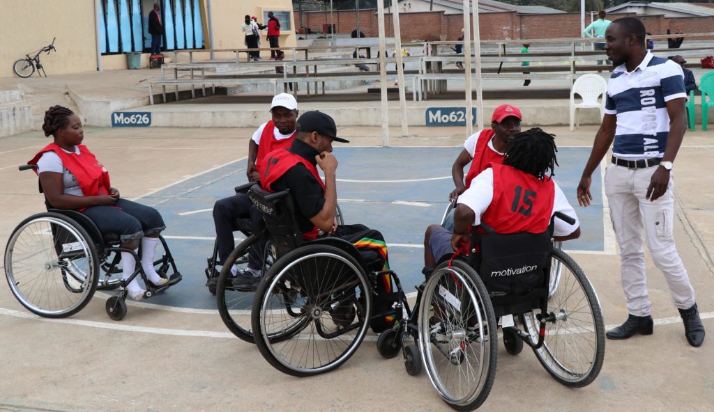 Charles with wheelchair basketball players