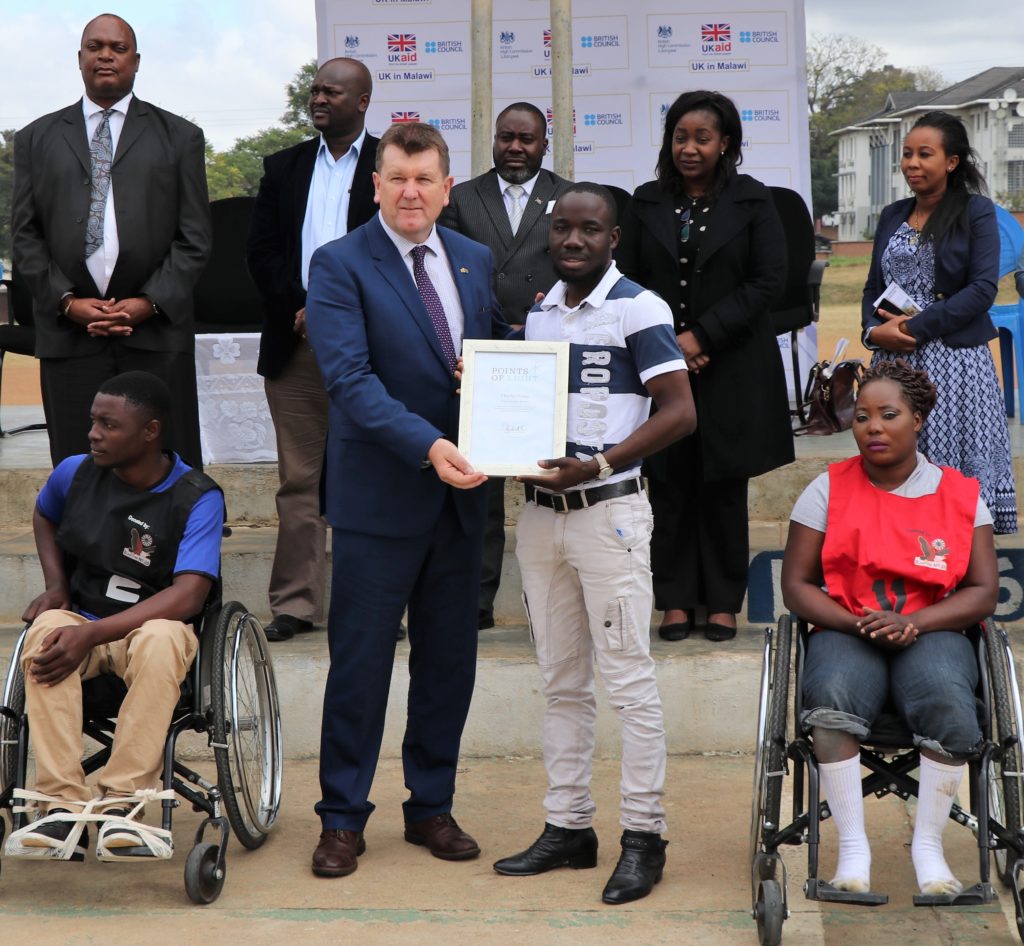 Charles Nyasa receiving his Commonwealth Points of Light award