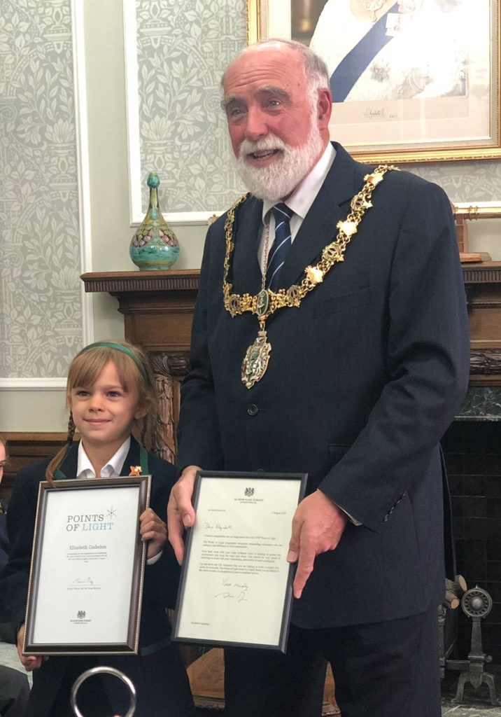 Elizabeth Gadsdon receiving her award from the Mayor of Wirral