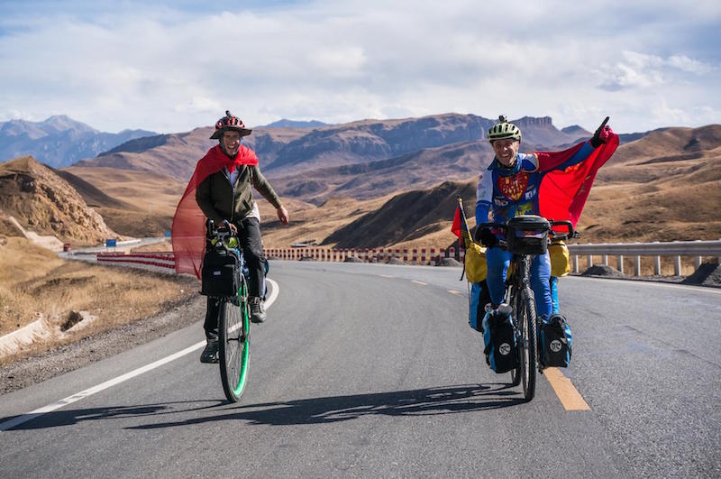 Ed Pratt on his unicycle in China with Super Cycling Man Will Hodsdon