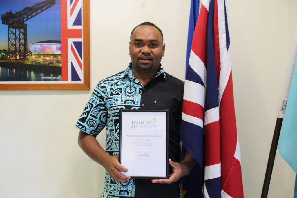 Jeremaia with his Commonwealth Points of Light award