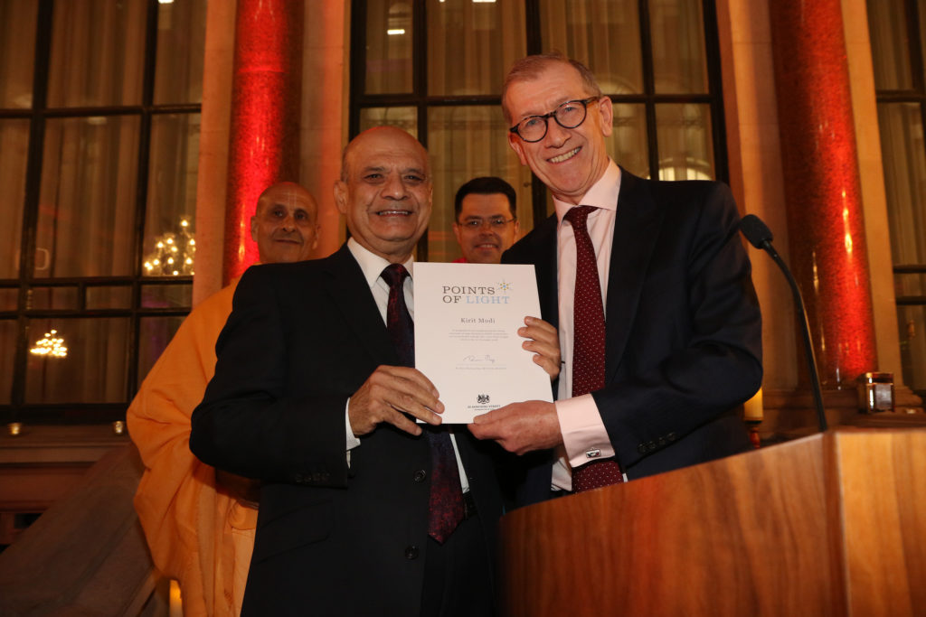 Kirit Modi receiving his award from Mr Philip May