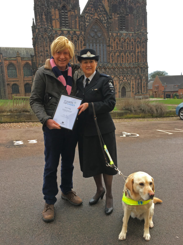 Carol Trigg with Michael Fabricant MP and her guide dog Flora outside Lichfield Cathedral