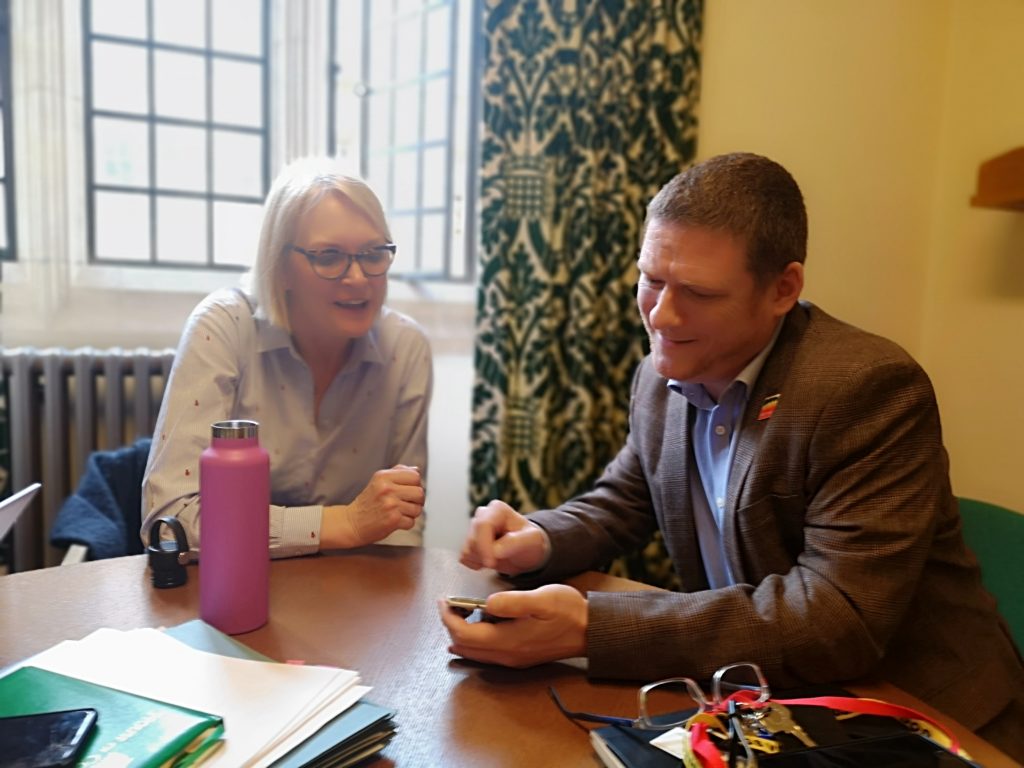 Jonathan showing Margot James the UK LGBT Archive