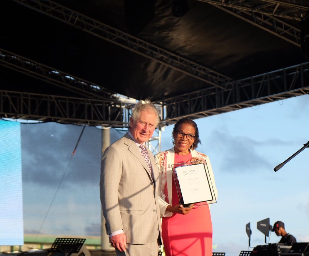 Dorothy Phillip receiving her award from Prince Charles