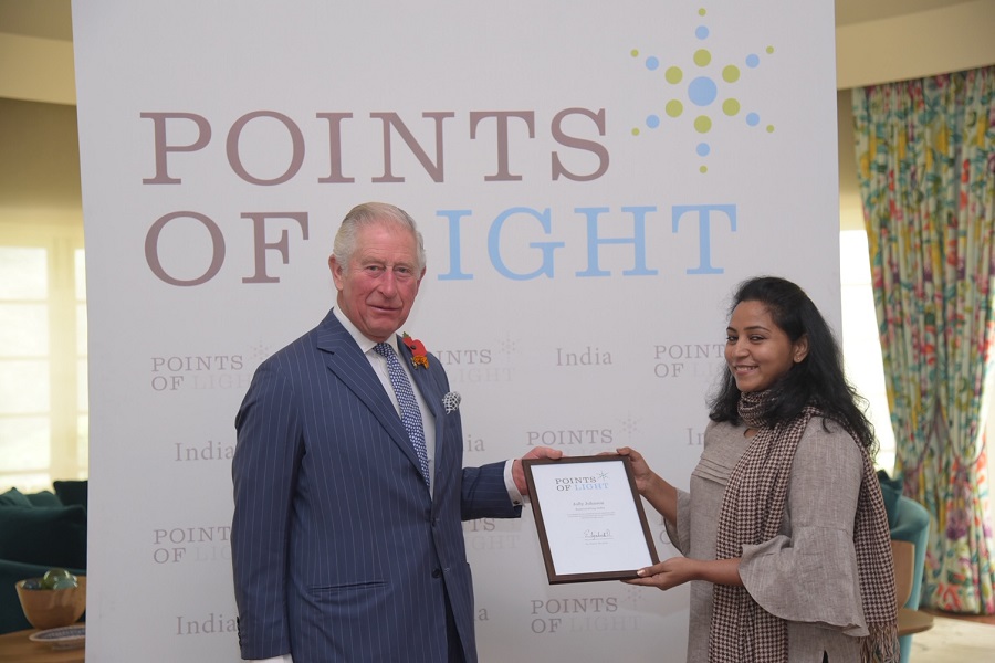 Prince Charles presents Jolly Johnson with her Commonwealth Points of Light award