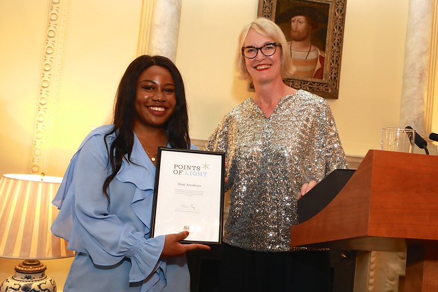 Simi Awokoya presented with her award by Margot James MP