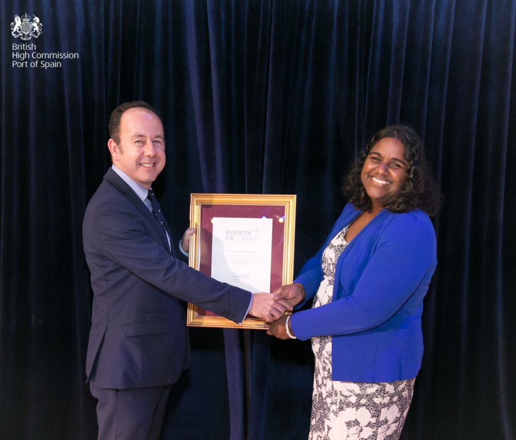 Asiya Mohammed receiving her award from Tim Stew