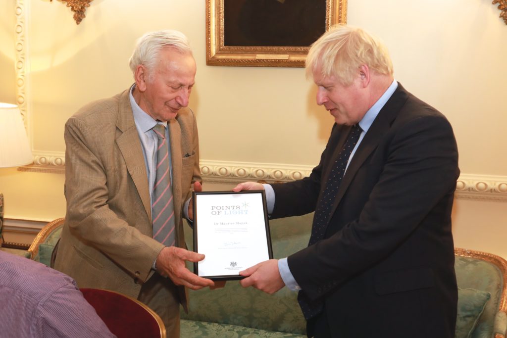 Dr Maurice Slapak receiving his Points of Light award from Prime Minister Boris Johnson