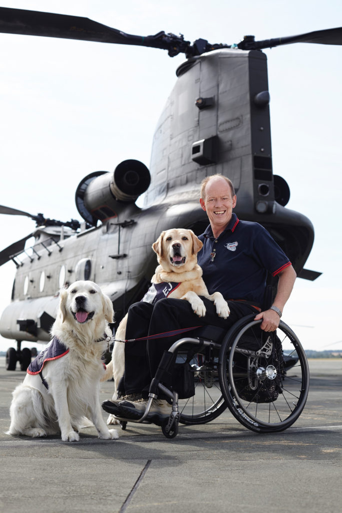 Allen Parton with dogs from Hounds for Heroes