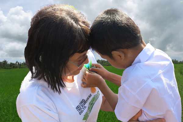 May Tha-Hla with one of the children supported by 'Helping the Burmese Delta'