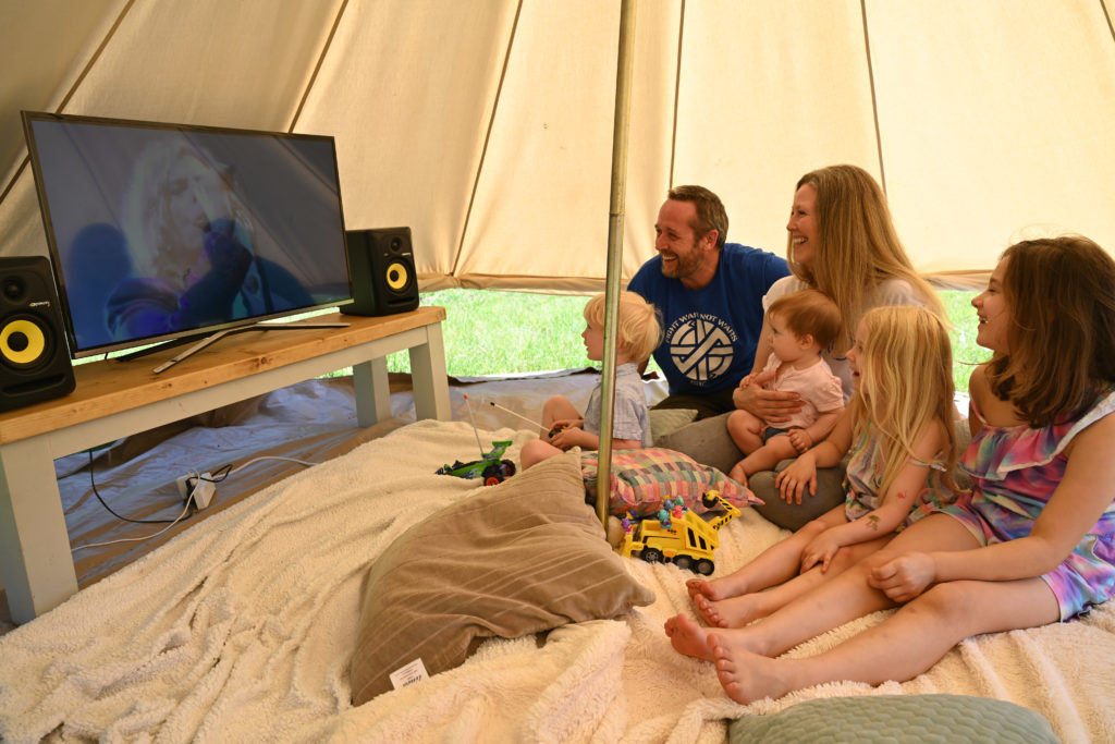 Sarah and family watching coverage of previous Glastonbury festivals