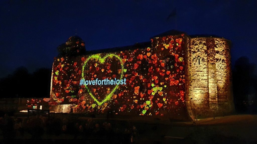 Yellow Hearts To Remember campaign light projection on Colchester Castle