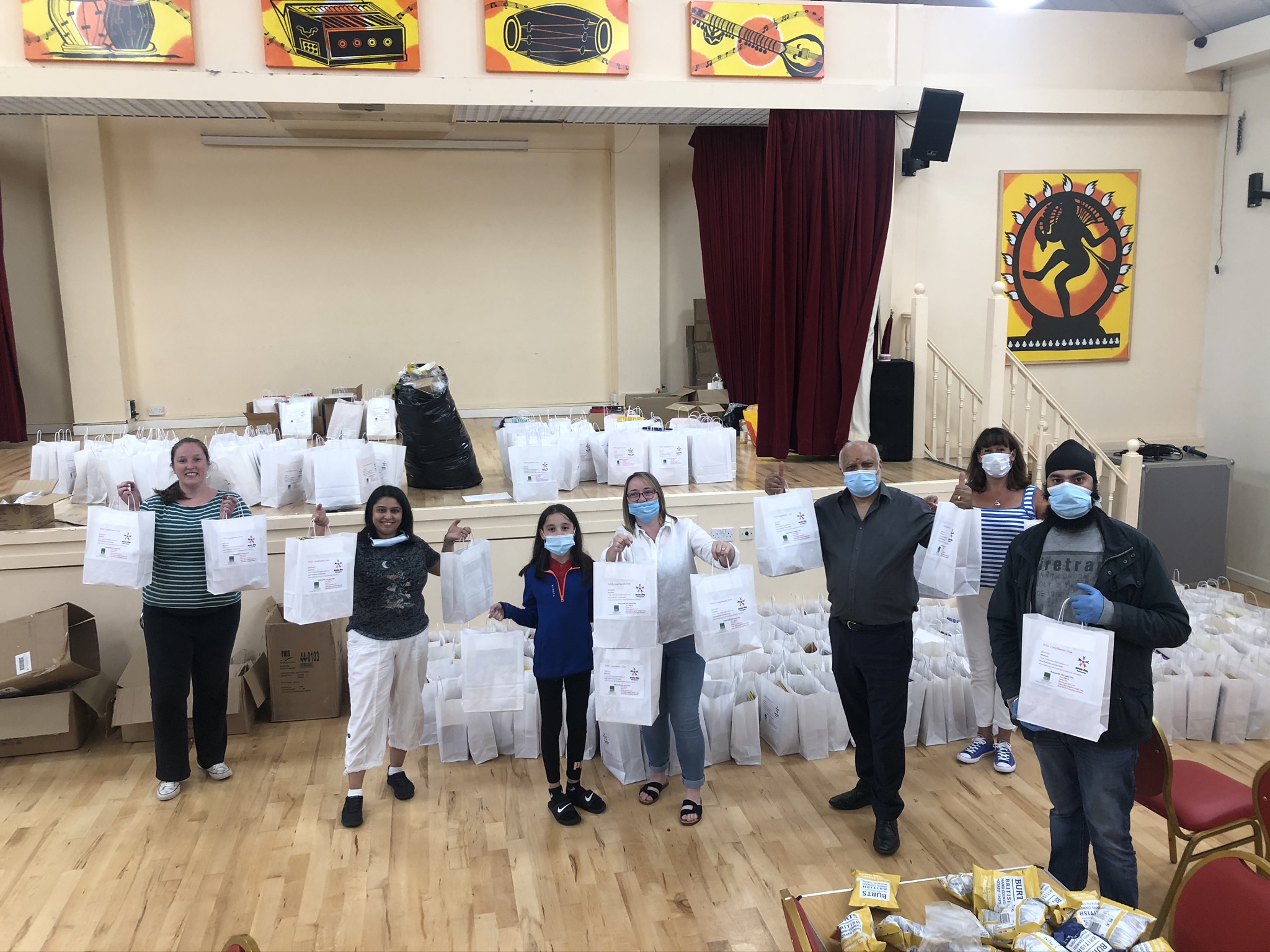 Sewa Day Nottingham volunteers with bags of prepared food