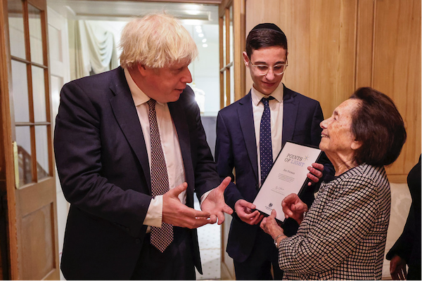Dov Forman with his great-grandmother Lily Ebert, presented with his award by PM Boris Johnson