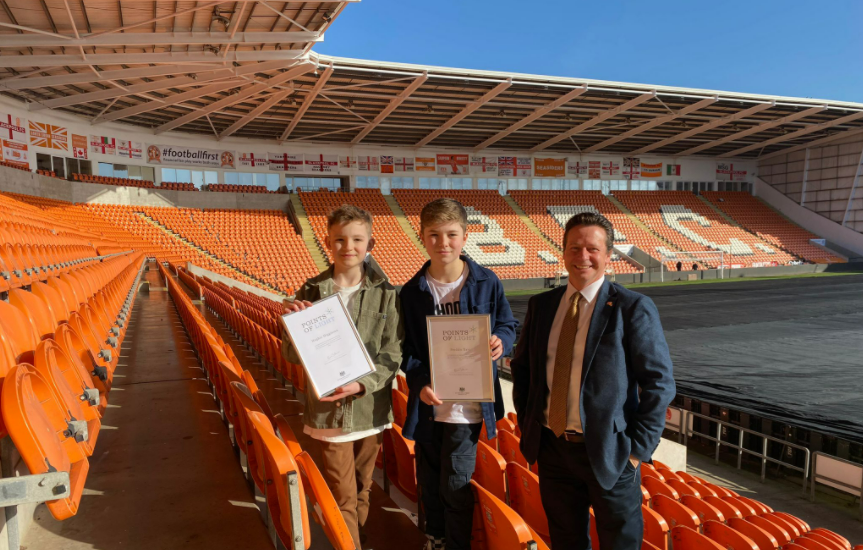 DCMS Minister Nigel Huddleston with Hughie and Freddie at Blackpool FC