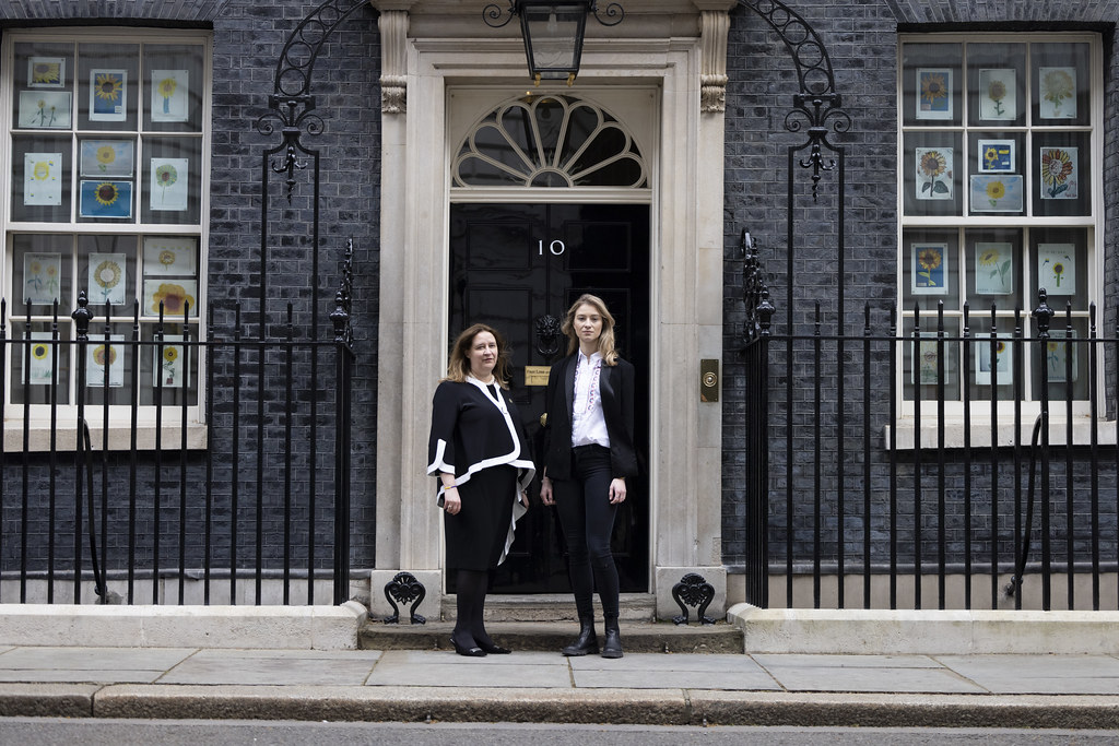 Magda Harvey and Kateryna Frolova of the Polish White Eagle Club outside 10 Downing Street