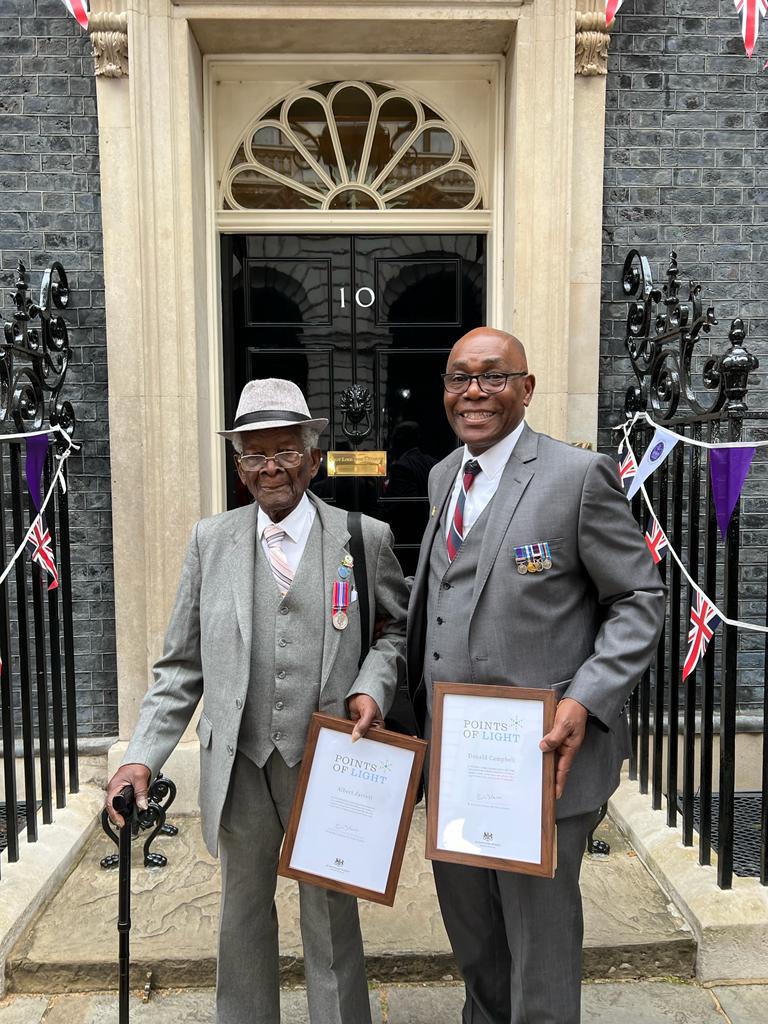 Albert and Donald with their Points of Light awards outside No10 Downing Street