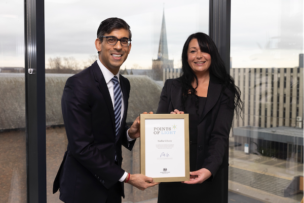 PM Rishi Sunak presenting a Points of Light award to Nadia Gibany